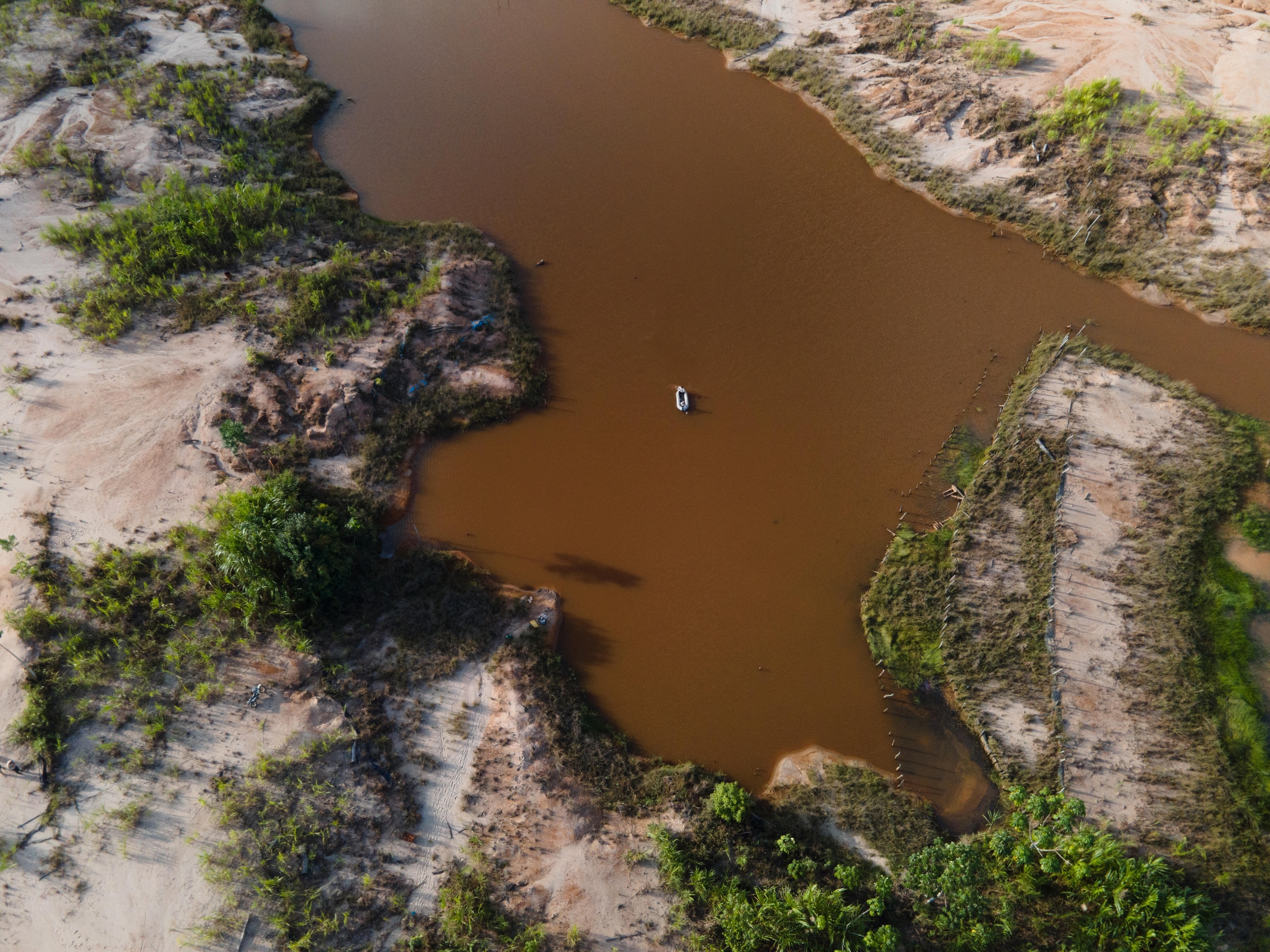 Aerial view of Peru's Madre de Dios region, where West and his colleagues are exploring the environmental legacy of artisanal gold mining and its associated mercury pollution to devise innovative scalable solutions to address ecosystem degradation and inform strategies for better land stewardship.