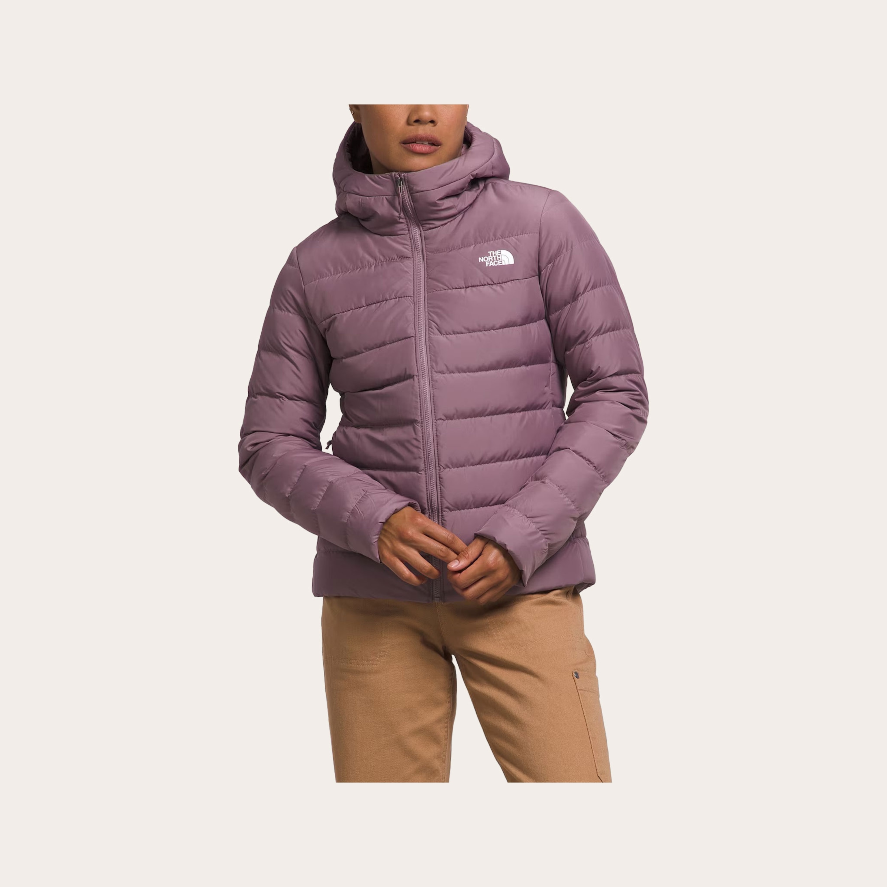 Woman wearing a purple winter jacket.